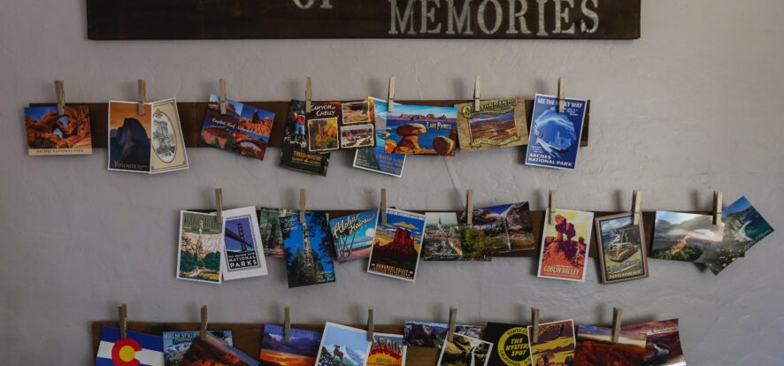 My nephew is a travel hound. He and his wife love road trips and started a wall to illustrate where all they have traveled together. I love the national parks retro design style and that makes up a good portion of the postcards on this wall of memories.